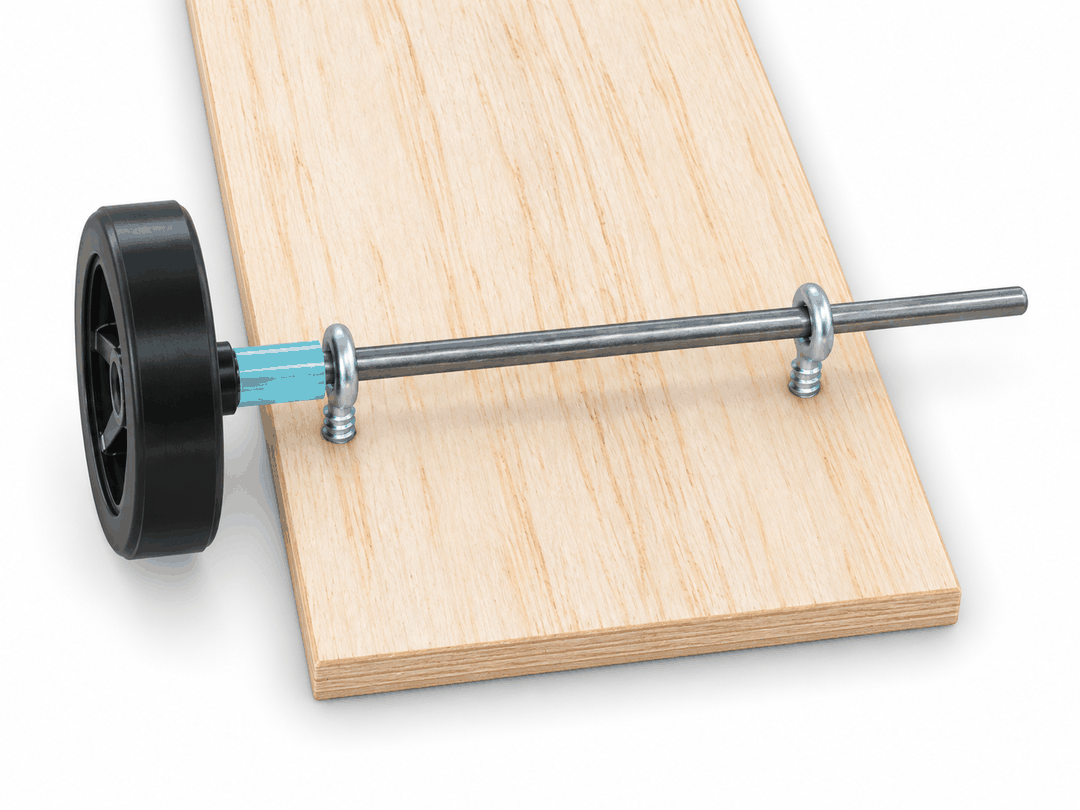 Axle with one wheel already mounted being passed through the eye screws
