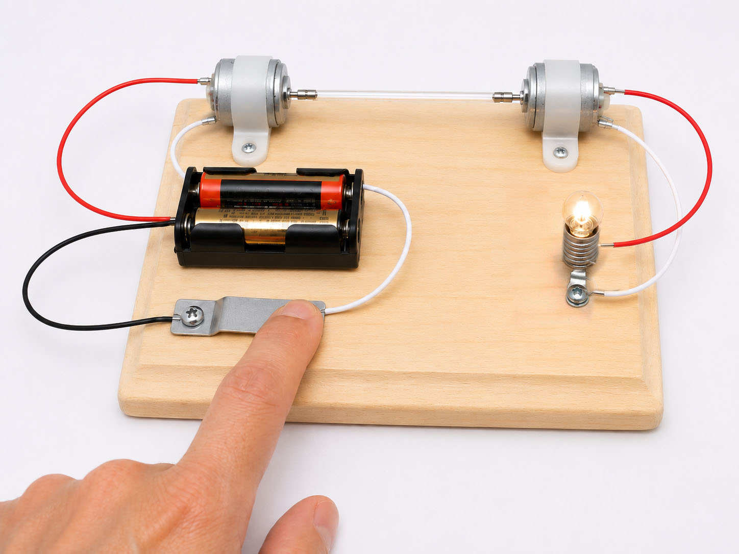 Pressing the switch lights the bulb powered by the generator